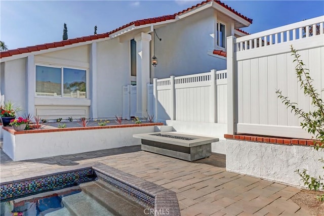 view of patio / terrace with a fire pit