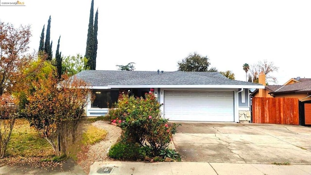 ranch-style house featuring a garage