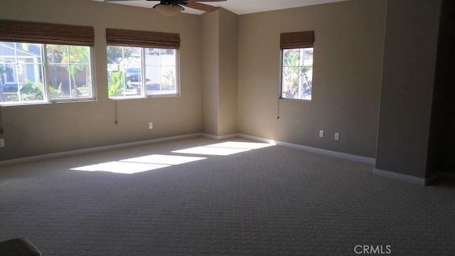 carpeted empty room with ceiling fan