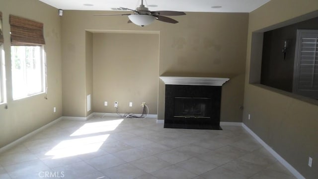 unfurnished living room with ceiling fan