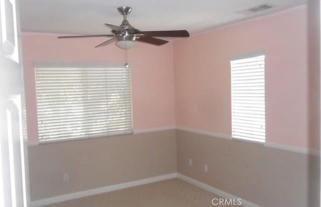 spare room featuring ceiling fan