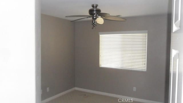 spare room with ceiling fan