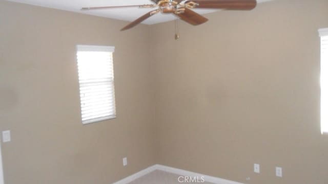 unfurnished room featuring ceiling fan