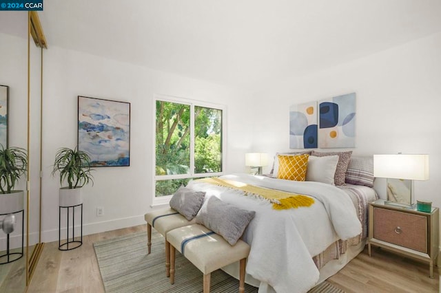 bedroom with light hardwood / wood-style floors