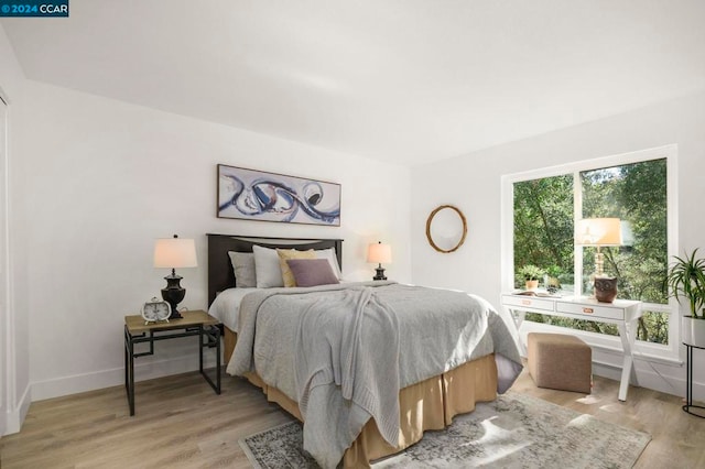 bedroom with light wood-type flooring