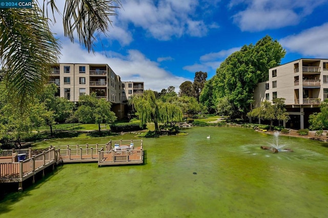 view of property's community with a lawn