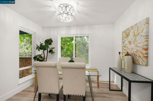 dining room featuring a chandelier and light hardwood / wood-style floors