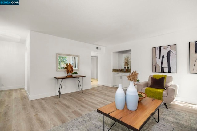 sitting room with light hardwood / wood-style floors