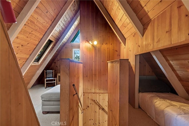 additional living space featuring wooden walls, carpet, lofted ceiling with beams, and wooden ceiling