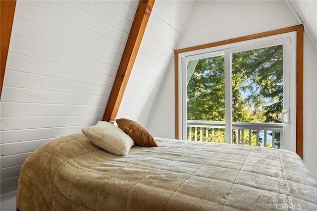 bedroom featuring lofted ceiling with beams