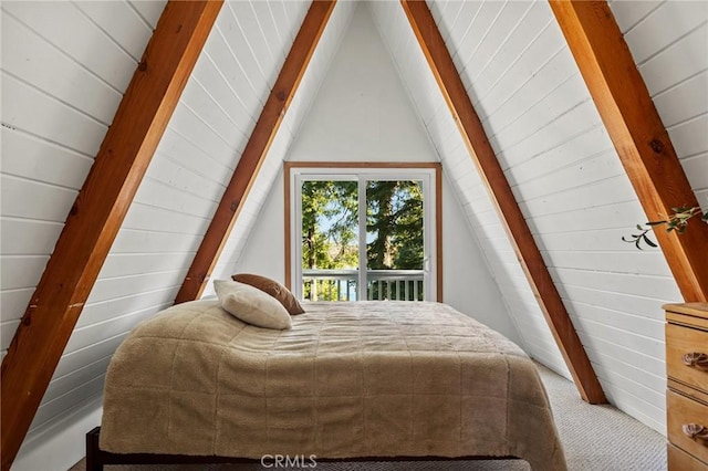 bedroom with access to outside, wooden walls, and lofted ceiling with beams