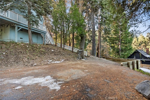 view of yard with a wooden deck