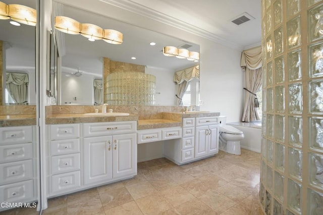 bathroom with toilet, ornamental molding, and vanity