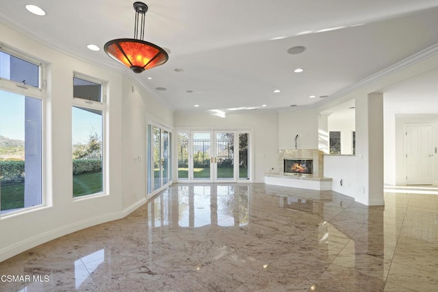 unfurnished living room with crown molding