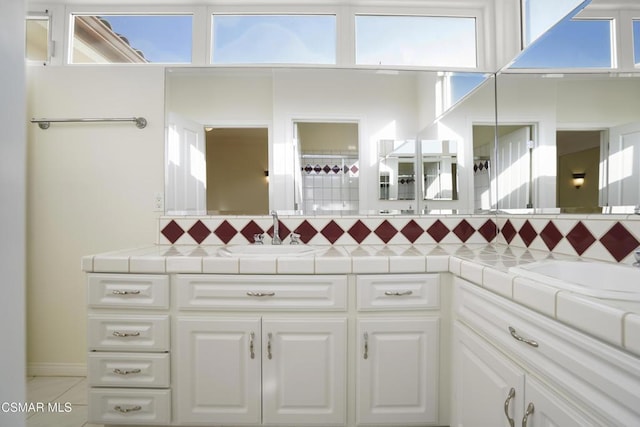 bathroom with vanity and tile patterned floors