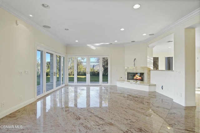 unfurnished living room featuring french doors and crown molding