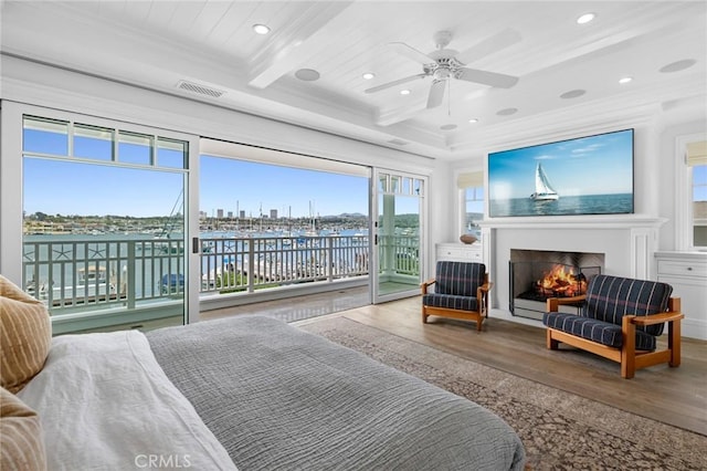 930 E Balboa Blvd, Newport Beach, CA 92661 - bedroom with access to outside, wood finished floors, ornamental molding, a lit fireplace, and beamed ceiling