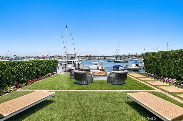 930 E Balboa Blvd, Newport Beach, CA 92661 - view of property's community featuring a boat dock, a lawn, and a water view
