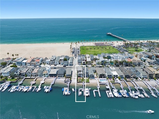 bird's eye view with a water view and a view of the beach