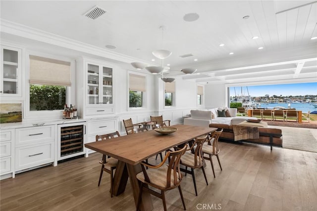 930 E Balboa Blvd, Newport Beach, CA 92661 - dining space featuring beverage cooler, wood-type flooring, healthy amount of natural light, bar, and recessed lighting