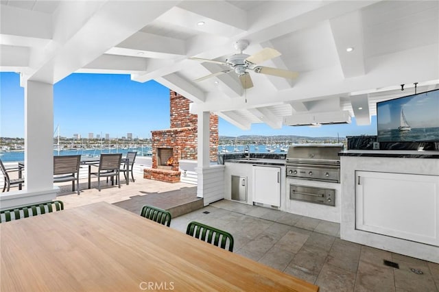 930 E Balboa Blvd, Newport Beach, CA 92661 - view of patio with an outdoor brick fireplace, ceiling fan, a sink, a view of city, and outdoor dining space