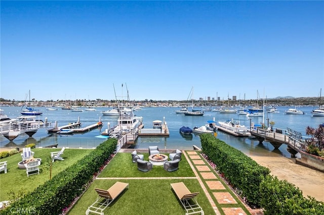 930 E Balboa Blvd, Newport Beach, CA 92661 - dock featuring an outdoor fire pit, a yard, and a water view