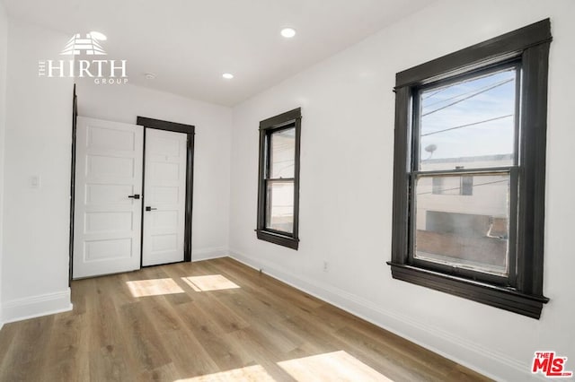 spare room featuring light hardwood / wood-style floors