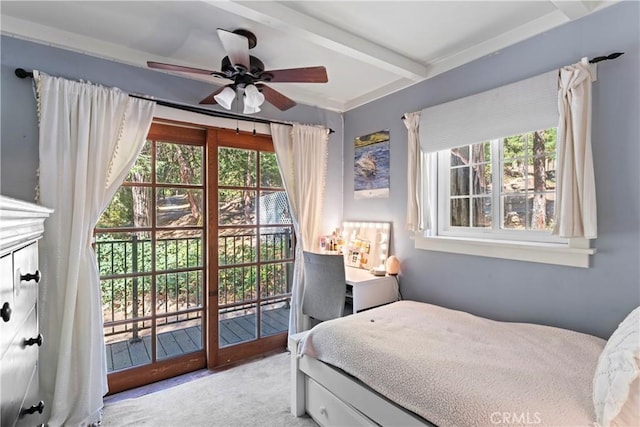 bedroom with beam ceiling, access to outside, multiple windows, and ceiling fan