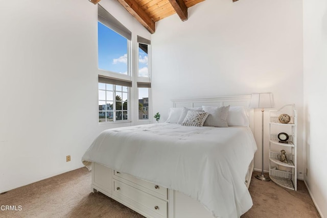 bedroom with beamed ceiling, light colored carpet, high vaulted ceiling, and wood ceiling