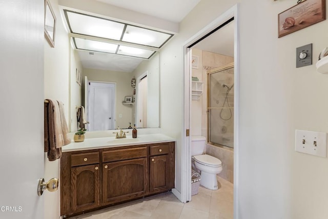 full bathroom featuring tile patterned flooring, vanity, toilet, and enclosed tub / shower combo