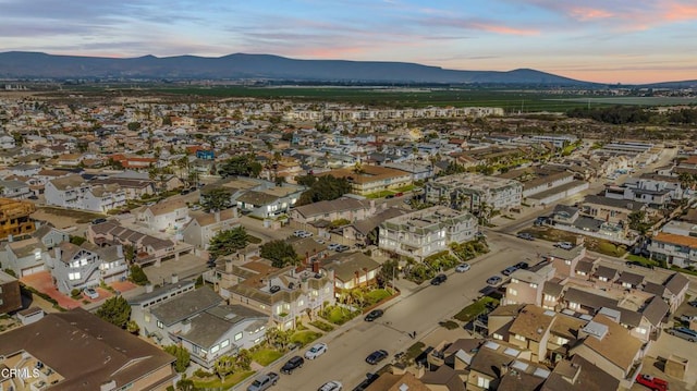 aerial view at dusk with a mountain view