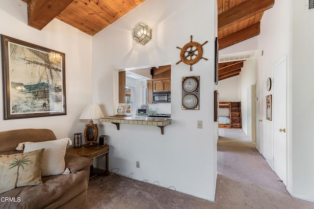 living room with light carpet, beamed ceiling, wood ceiling, and high vaulted ceiling