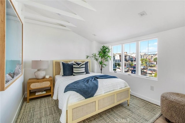 bedroom featuring lofted ceiling