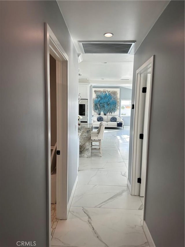 corridor featuring recessed lighting, marble finish floor, visible vents, and baseboards