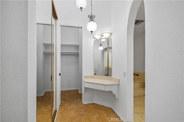 bathroom featuring parquet floors