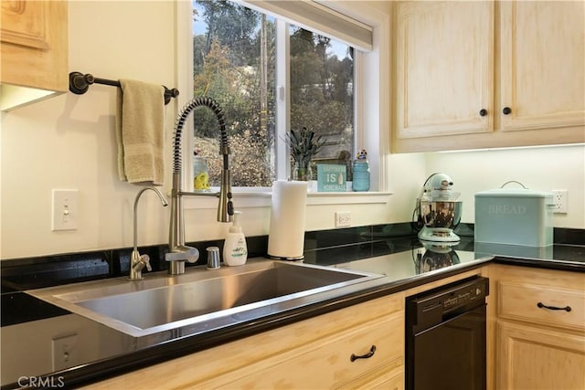 kitchen with black dishwasher, sink, and light brown cabinetry