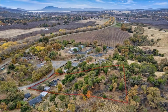 birds eye view of property featuring a mountain view