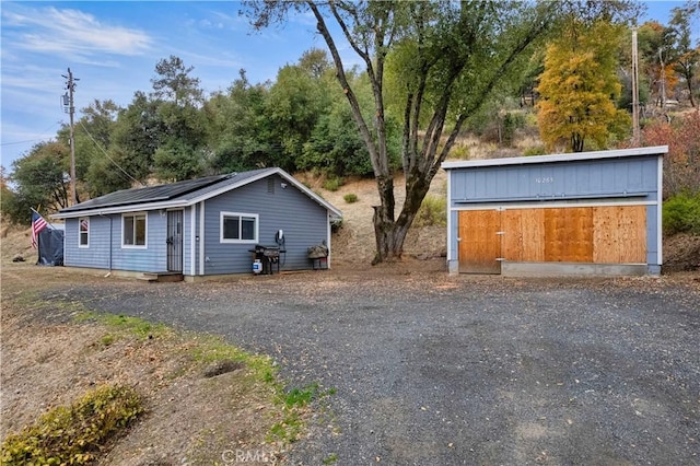 view of front of home featuring solar panels