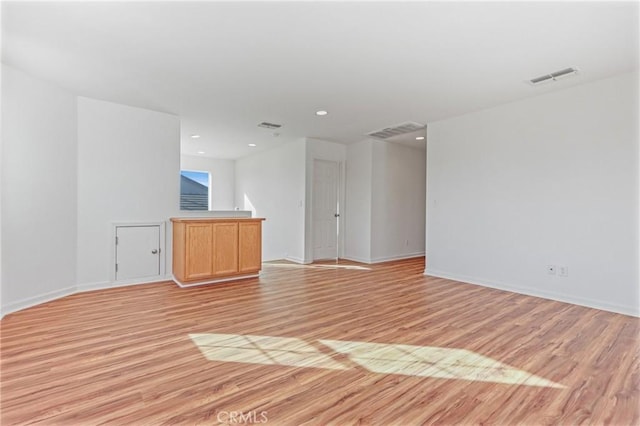 spare room with light hardwood / wood-style floors