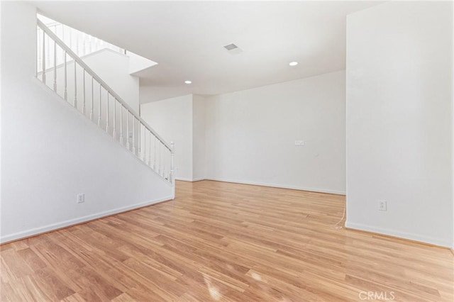 unfurnished living room featuring light wood-type flooring