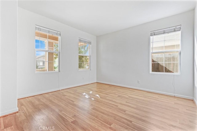 unfurnished room featuring light wood-type flooring