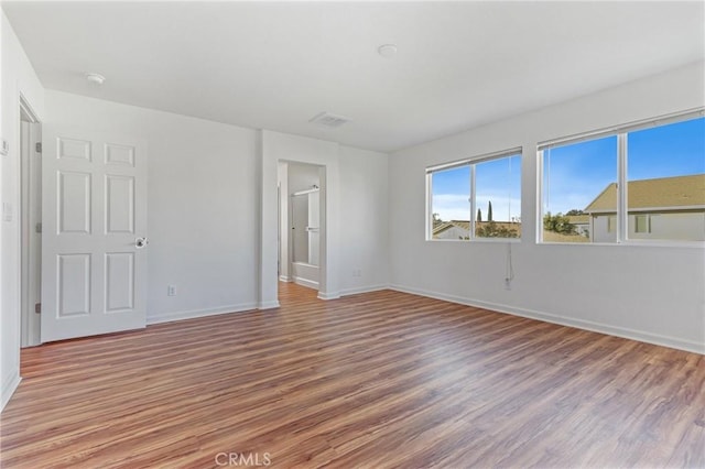 empty room featuring hardwood / wood-style flooring