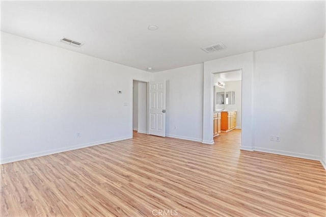 unfurnished room with light hardwood / wood-style flooring