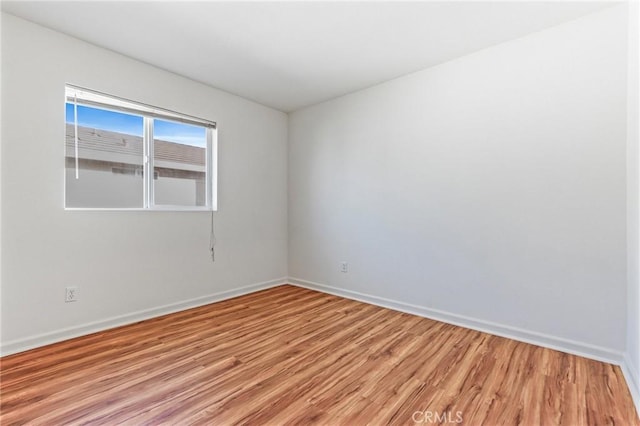 unfurnished room featuring wood-type flooring