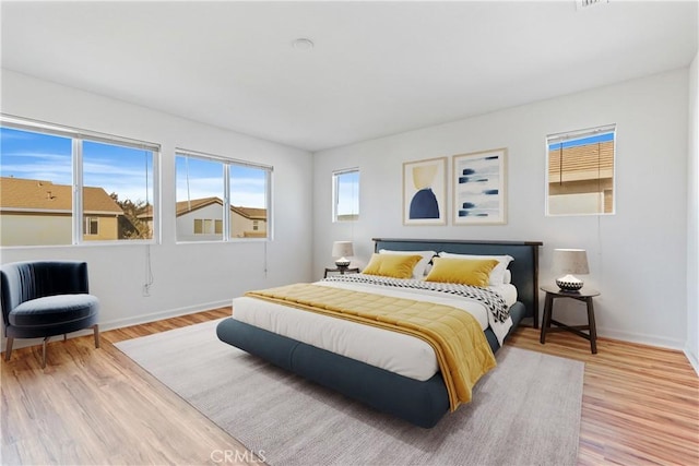 bedroom with light hardwood / wood-style flooring