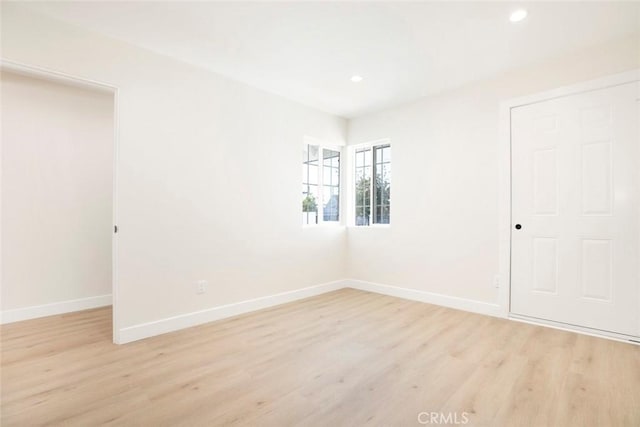 unfurnished room featuring light wood-type flooring