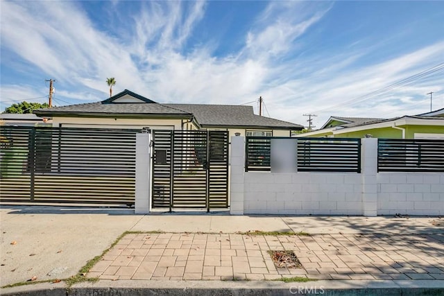 view of gate featuring a garage