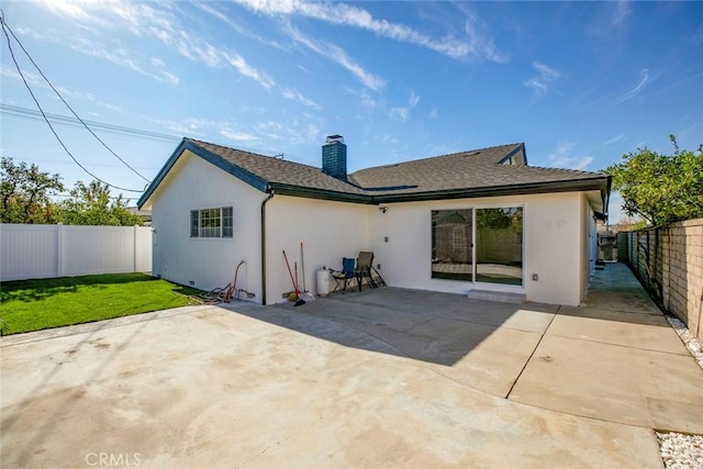 rear view of property with a patio area