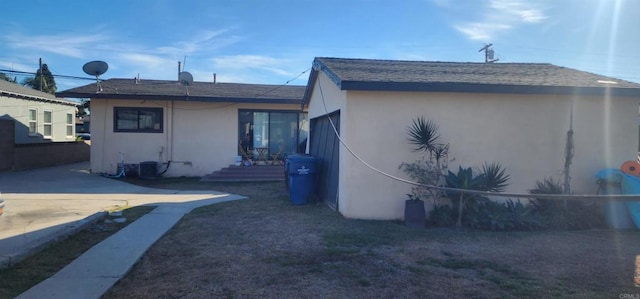 view of property exterior with a patio area