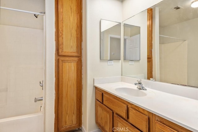 bathroom featuring vanity and bathing tub / shower combination